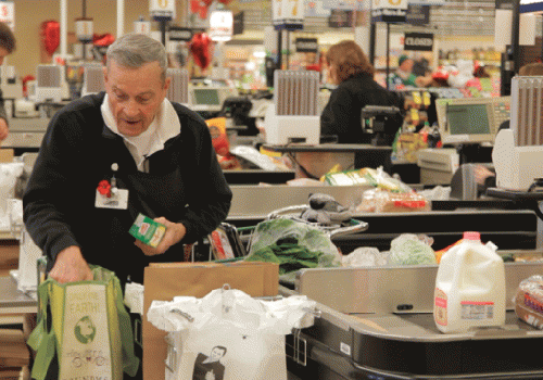 Harvey Kurz, bags groceries. Milwaukee, WI.