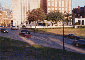 Dealey Plaza View from Behind Grassy Knoll Picket Fence, From ImagesAttr