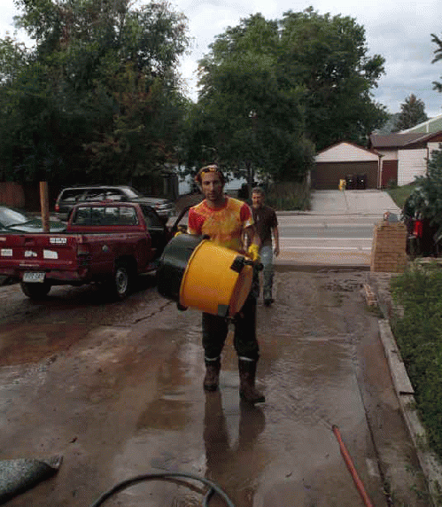 My friend clearing flood water from his house, From ImagesAttr