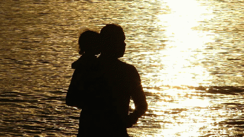 Father and child at sunset, From ImagesAttr