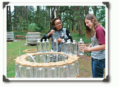 Volunteers help install 'Water Towers'