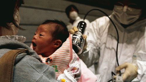 Nagashima Rio who was born on March 15, is tested for possible nuclear radiation at an evacuation centre in Koriyama, Fukushima Prefecture, northern Japan, located about 60 km from the tsunami and earthquake-crippled nuclear reactor, March 31, 2011. (Reut