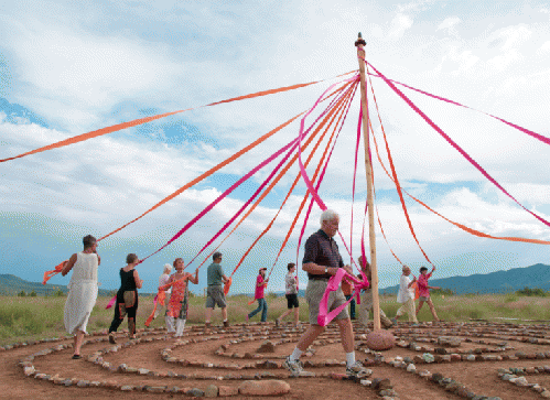 Dancing the maypole in the classic labyrinth at Whitewater Mesa Labyrinths, NM, 2012.