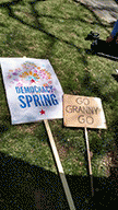 two signs at day 2 of Democracy Spring