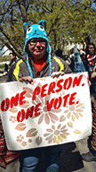 rally participant with an important sign