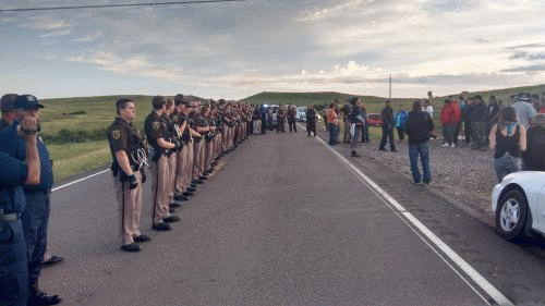 Officers from the Morton County Sherriff's Dept. line up facing Dakota Access Pipeline protesters in North Dakota, August 15., From ImagesAttr