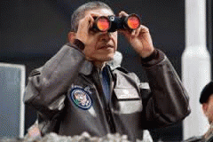 Near the ceasefire line between North and South Korea, President Barack Obama uses binoculars to view the DMZ from Camp Bonifas, March 25, 2012.