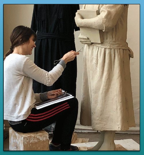 A StudioEIS sculptor works on the clay version of the statue of Virginia Randolph.