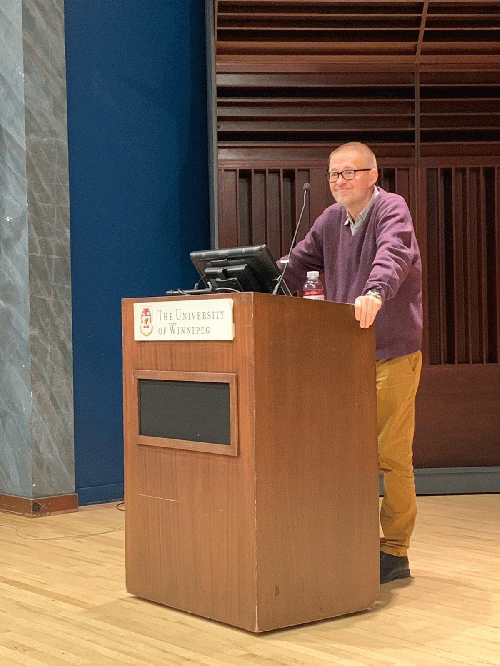 addressing students and professors at University of Winnipeg