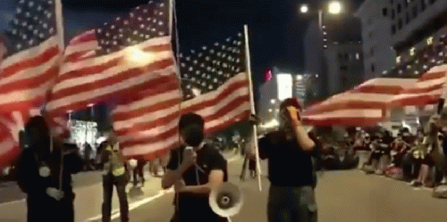 Hong Kong protesters waving U.S. flags last week., From Uploaded