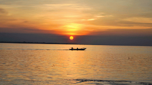 Boat on river Padma at sunset