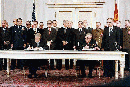 President Jimmy Carter and Soviet General Secretary Leonid Brezhnev sign the Strategic Arms Limitation Talks (SALT II) treaty, June 18, 1979, in Vienna.