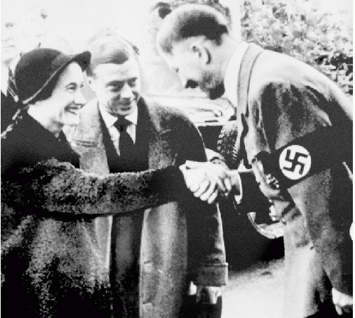 File photo dated 23/10/1937 of the Prince Edward and Duchess of Windsor meeting with German leader Adolf Hitler in Munich as Buckingham Palace has defended footage from 1933 that shows a young Queen performing a Nazi salute with her family at Balmoral