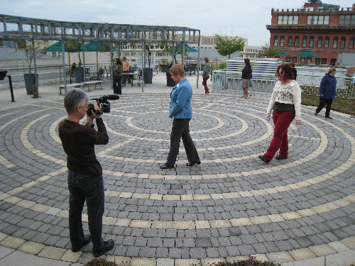 Cintia filming the labyrinth walkers on the American Psychological Association building's green roof in Washington, DC.