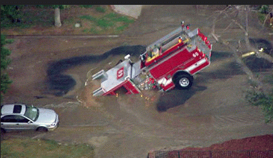 Figure 2: Another water main break scours out the dirt under a road to collapse the road, Los Angeles, 2009.