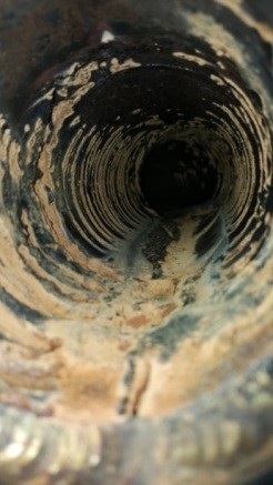 Figure 4: Tiger stripes in a cast iron pipe caused by water hammer fatigue cracks.