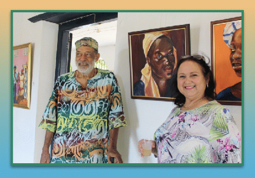 Artist Richard Doest with collector Valentina Engelhardt standing in front of his painting